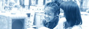 Young child smiling in school classroom